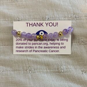Purple and Gold Beaded Bracelet 100% donation made to fund pancan.org